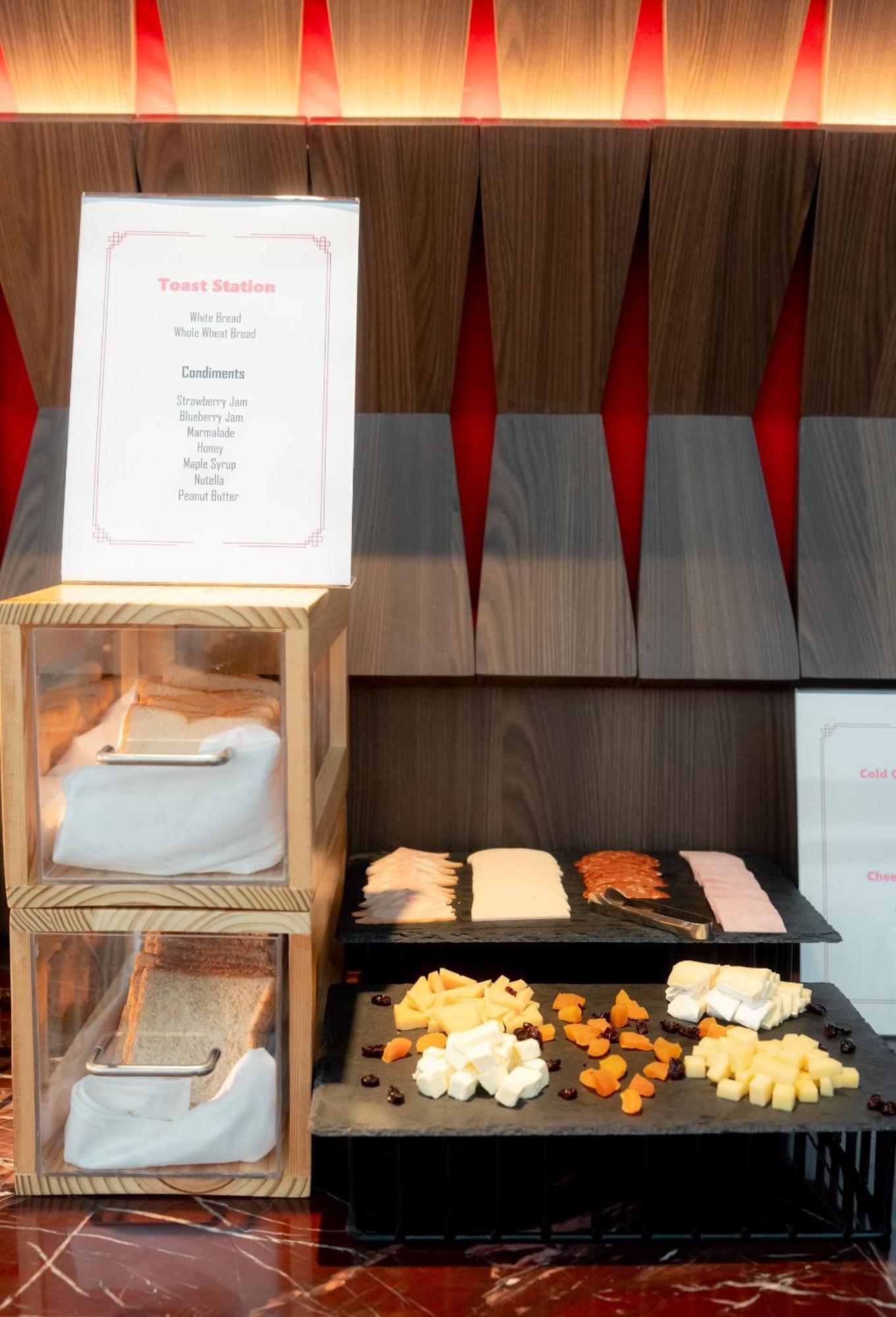 Ascott Embassy Sathorn Bangkok Hotel Ngoại thất bức ảnh A selection of cheese at a buffet
